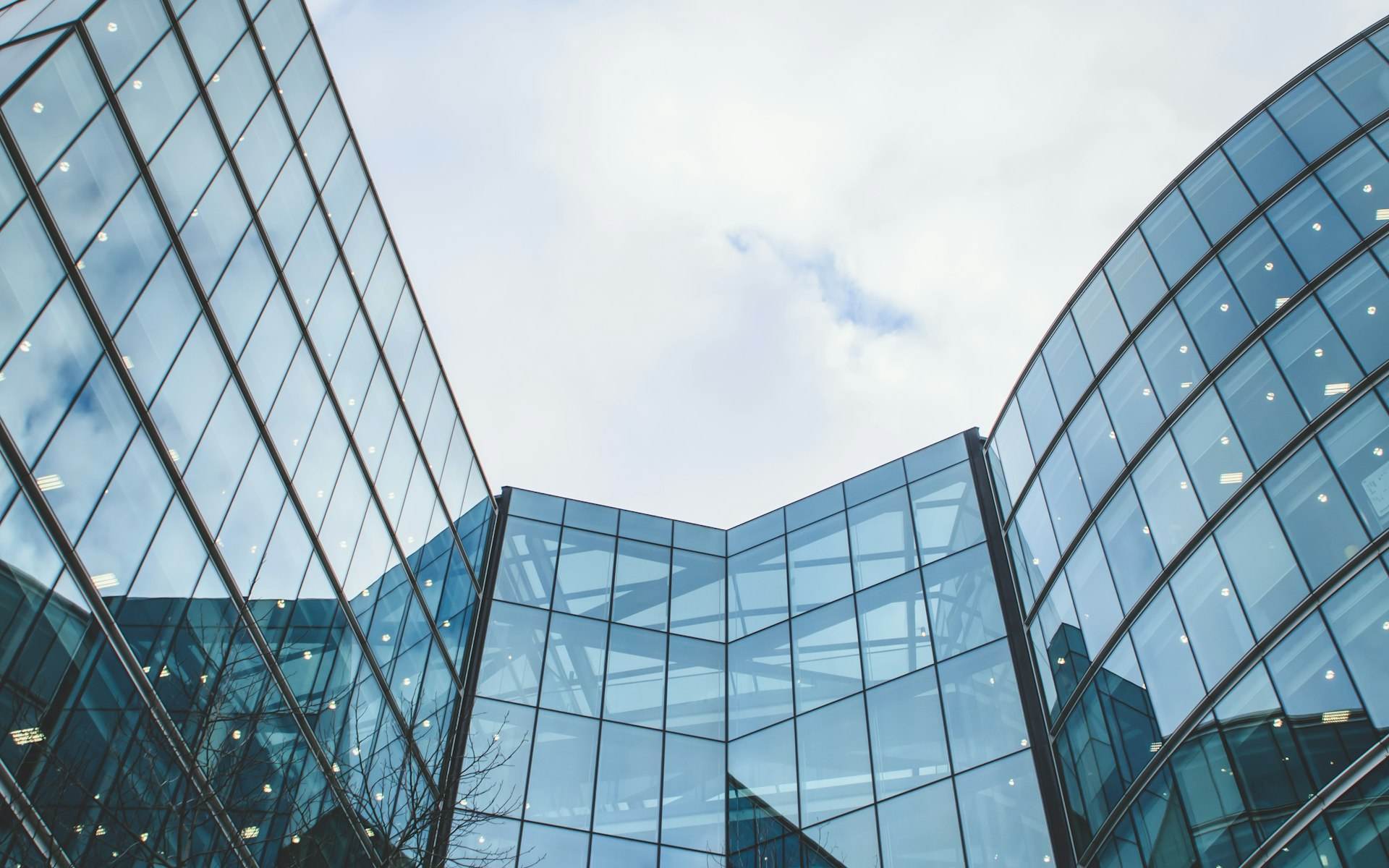 Modern glass office tower against the sky