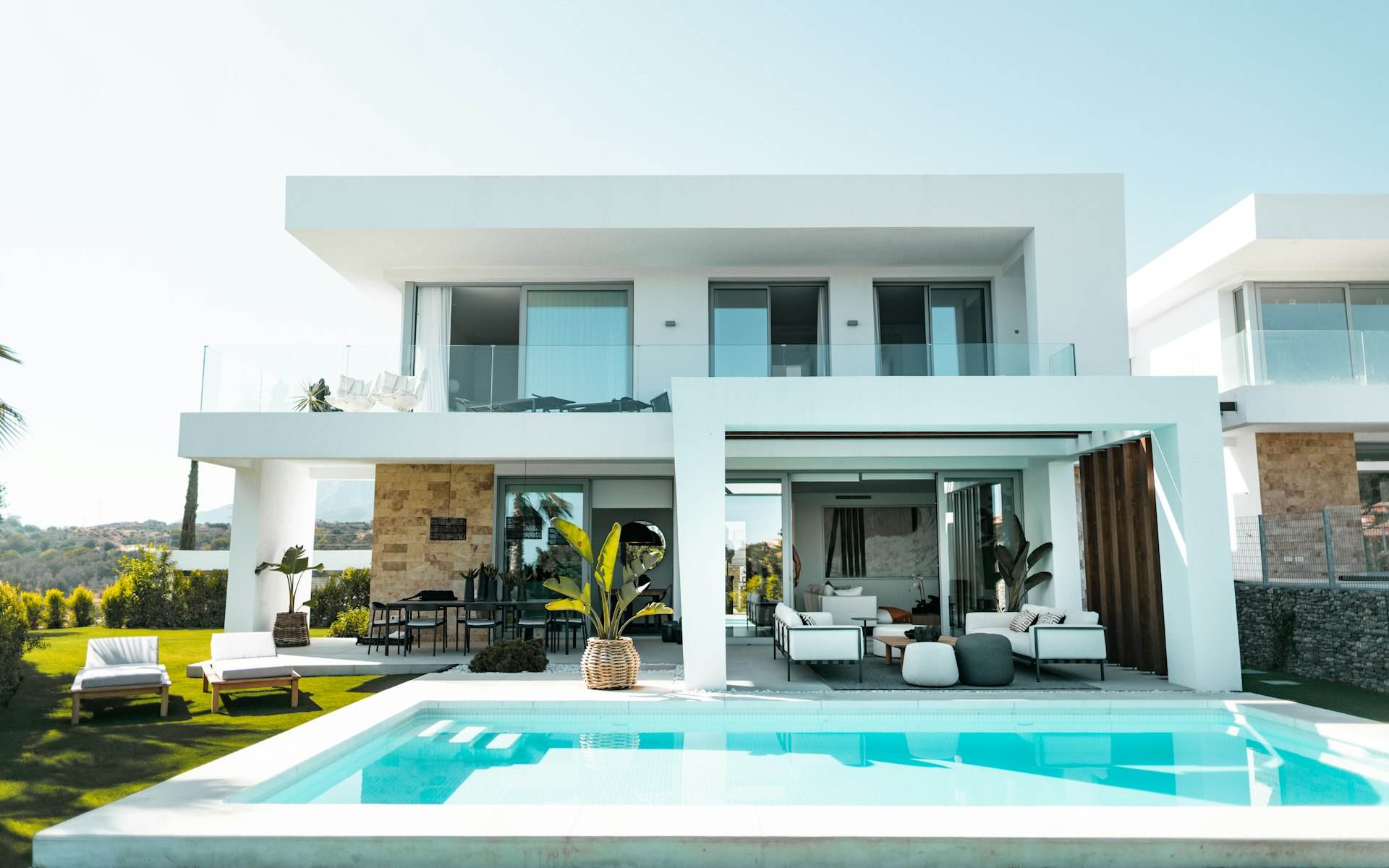 Modern luxury home with pool at dusk